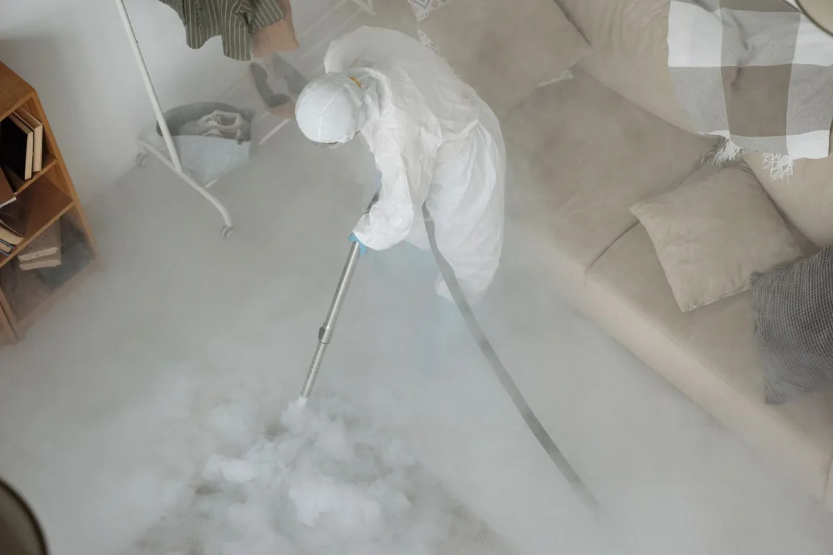Biohazard cleanup technician in protective equipment, Blanco, TX